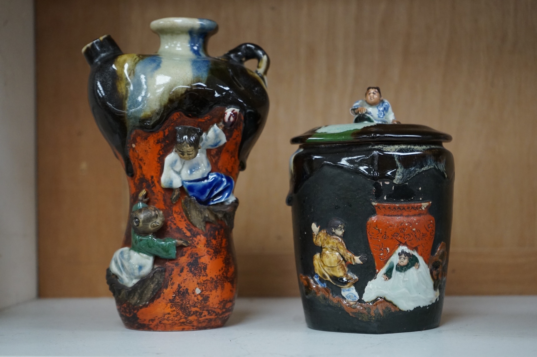 A Japanese Sumida pottery vase and a similar jar and cover, largest 21cm high
